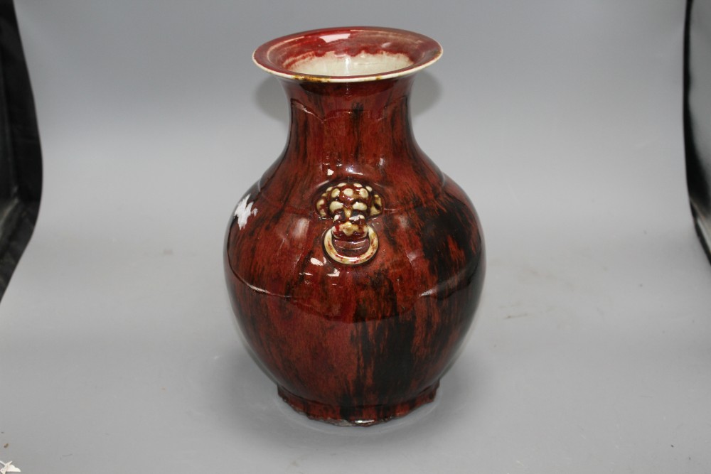 A Chinese flambe vase, with lion mask ring handles to the shoulder, H. 28.5cm